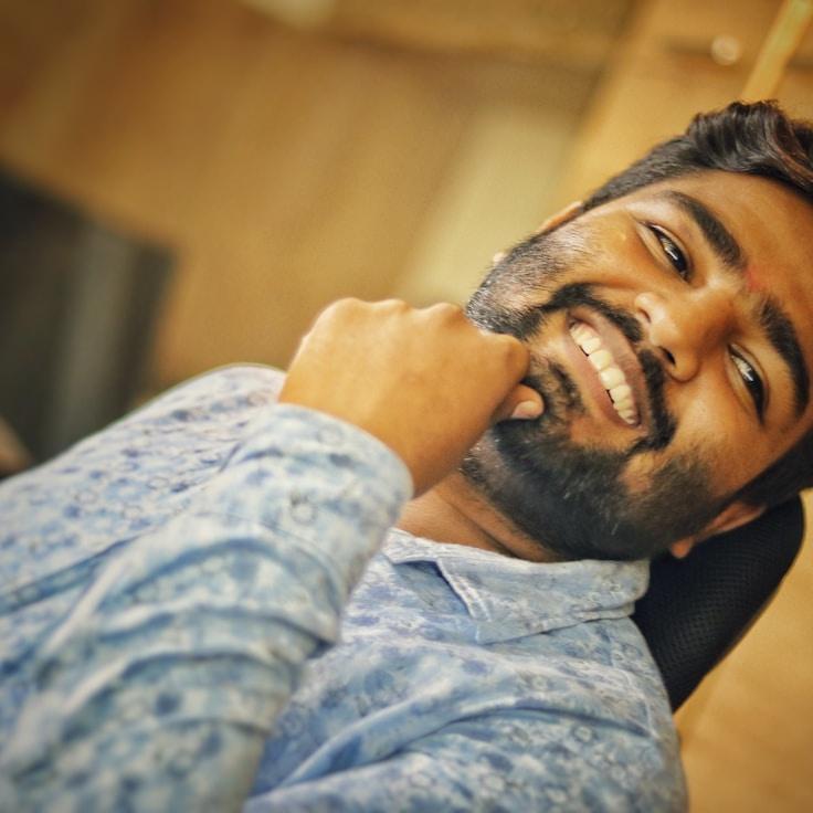 Ava Rao, Lead Floral Designer at PaperCrestGrove, reviewing corporate floral arrangements